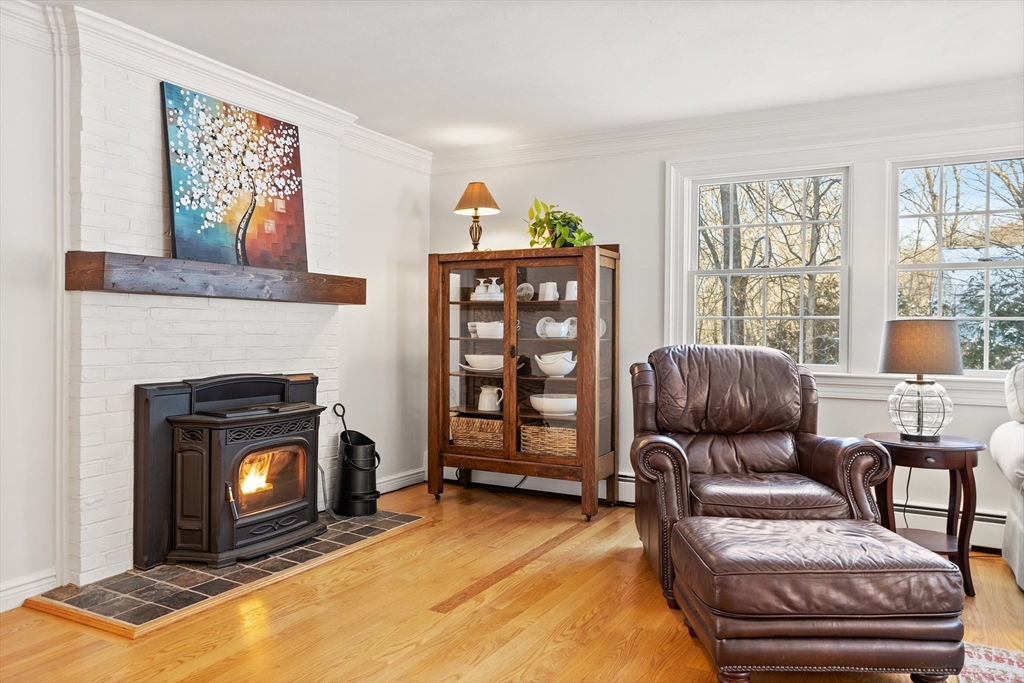 84 Vaughn Hill Road Bolton, MA 01740 - Photo 11 of 40 a living room with furniture and a fireplace