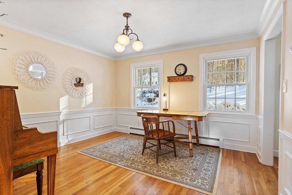 84 Vaughn Hill Road Bolton, MA 01740 - Photo 14 of 40 a view of a dining room with furniture window and wooden floor