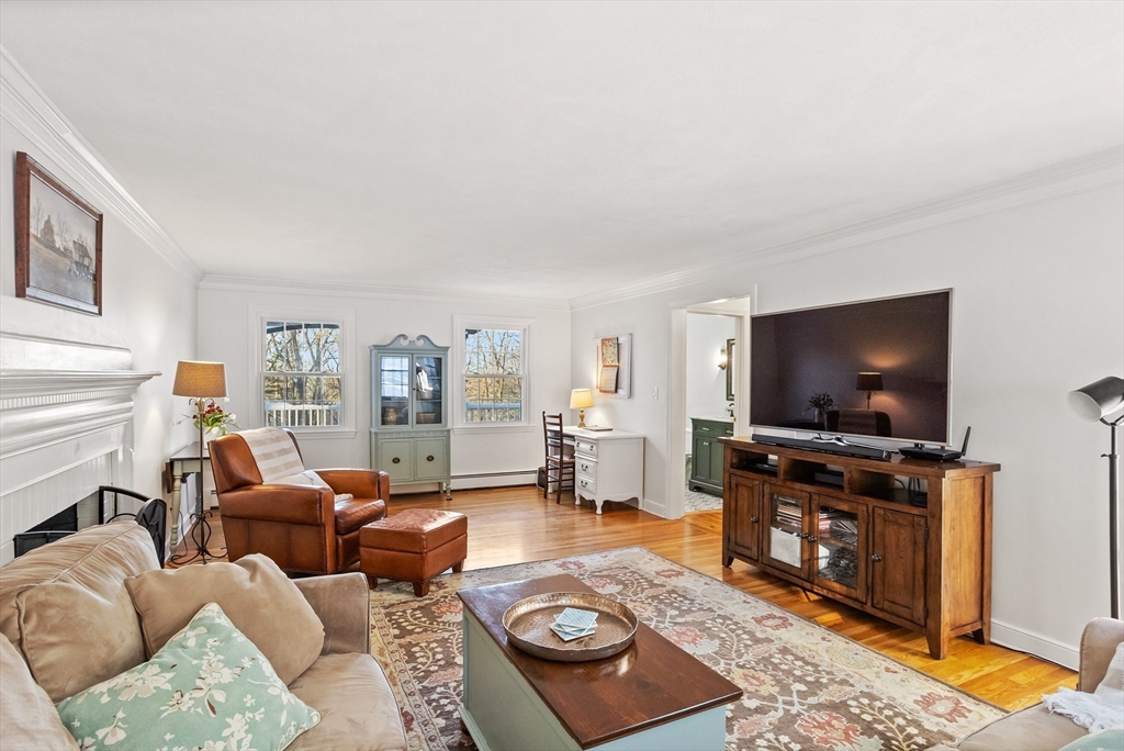 84 Vaughn Hill Road Bolton, MA 01740 - Photo 17 of 40 a living room with furniture and a flat screen tv