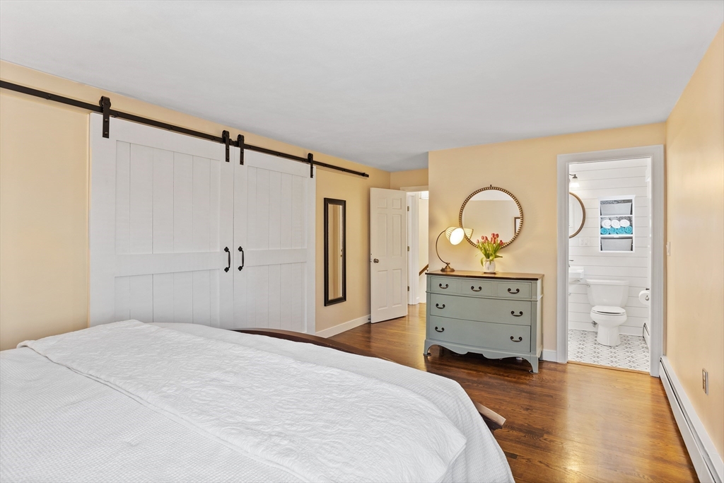 84 Vaughn Hill Road Bolton, MA 01740 - Photo 20 of 40 a bedroom with a bed and closet