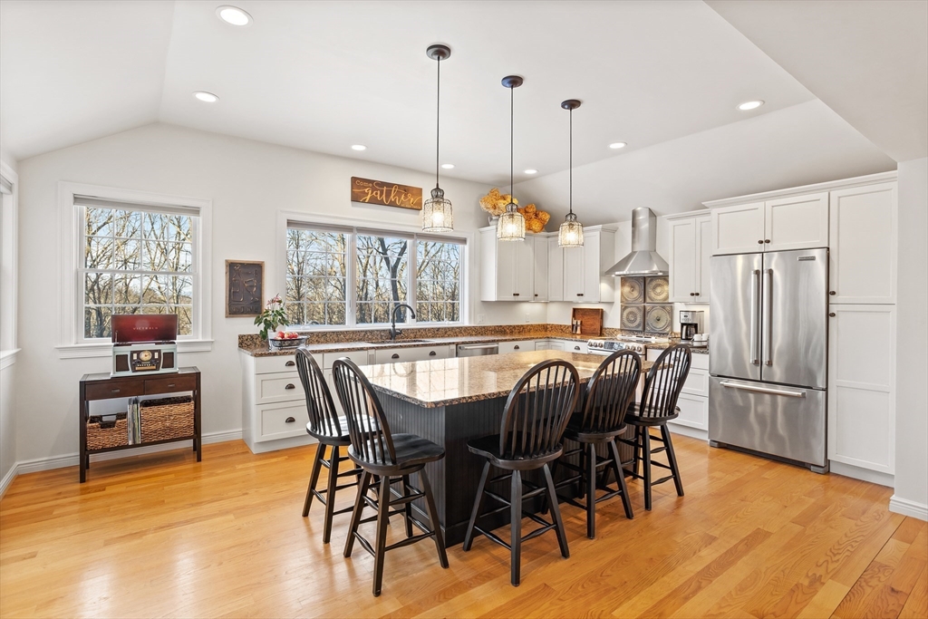 84 Vaughn Hill Road Bolton, MA 01740 - Photo 2 of 40 a view of a dining room with furniture window and wooden floor
