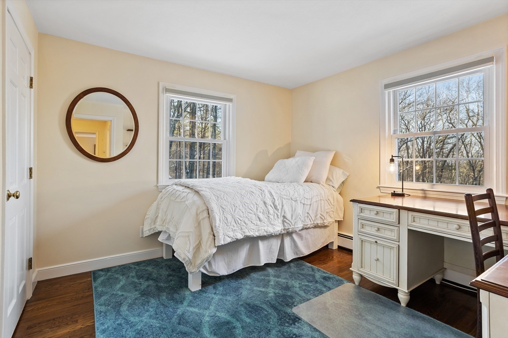 84 Vaughn Hill Road Bolton, MA 01740 - Photo 23 of 40 a bed room with a bed and a window