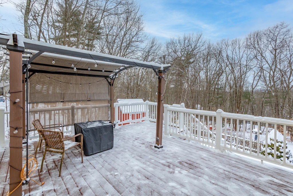84 Vaughn Hill Road Bolton, MA 01740 - Photo 27 of 40 a view of a chair and table in the balcony
