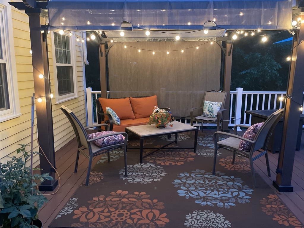 84 Vaughn Hill Road Bolton, MA 01740 - Photo 28 of 40 a outdoor living space with furniture and a potted plant