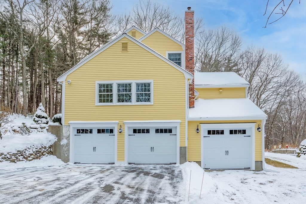 84 Vaughn Hill Road Bolton, MA 01740 - Photo 29 of 40 a view of a house with a wooden fence