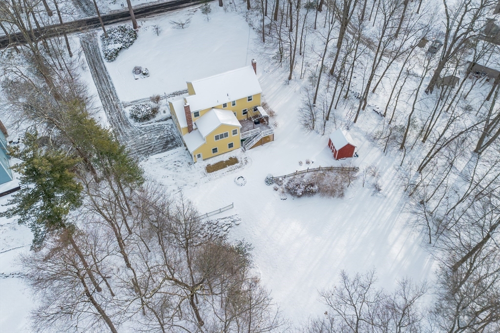 84 Vaughn Hill Road Bolton, MA 01740 - Photo 32 of 40 a white bed sitting in the middle of a yard