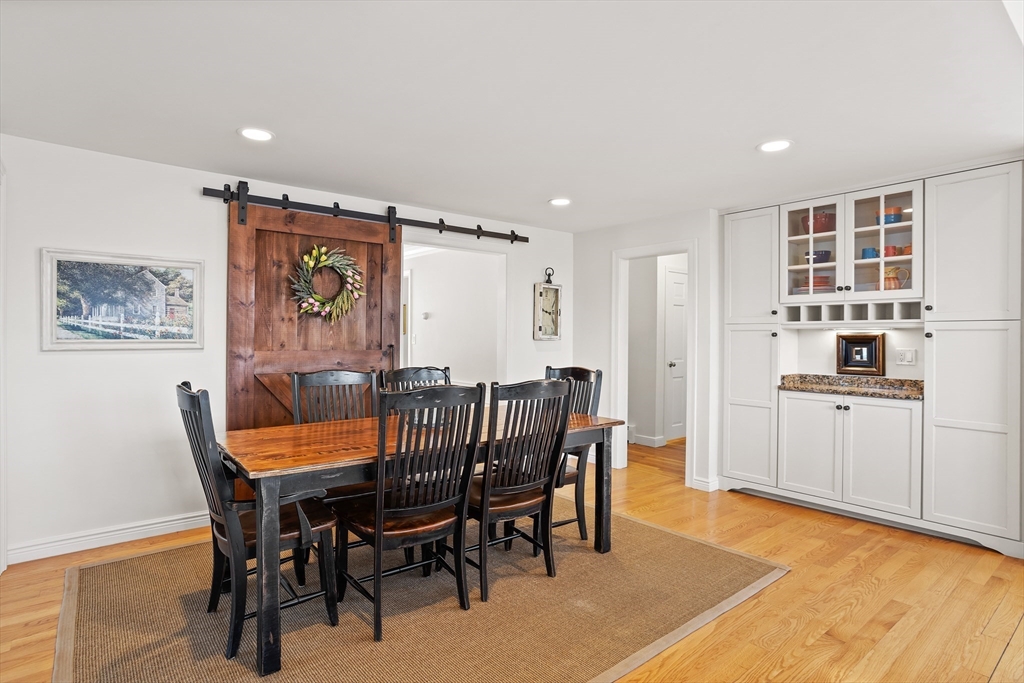 84 Vaughn Hill Road Bolton, MA 01740 - Photo 7 of 40 a view of a dining room with furniture