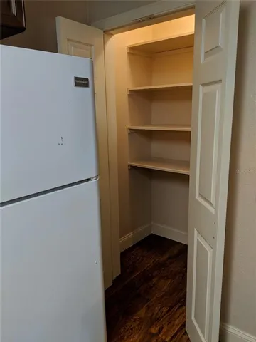 a bathroom with a toilet a sink and a mirror