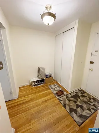 a bedroom with a bed and a mirror