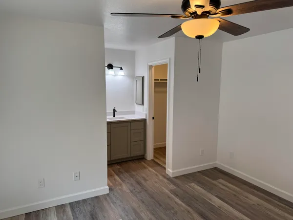 a view of a kitchen with a sink and cabinet