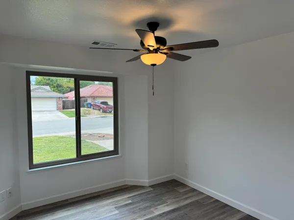 a view of an empty room with windows