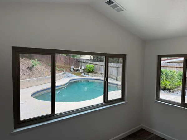 a view of a room that has a large window