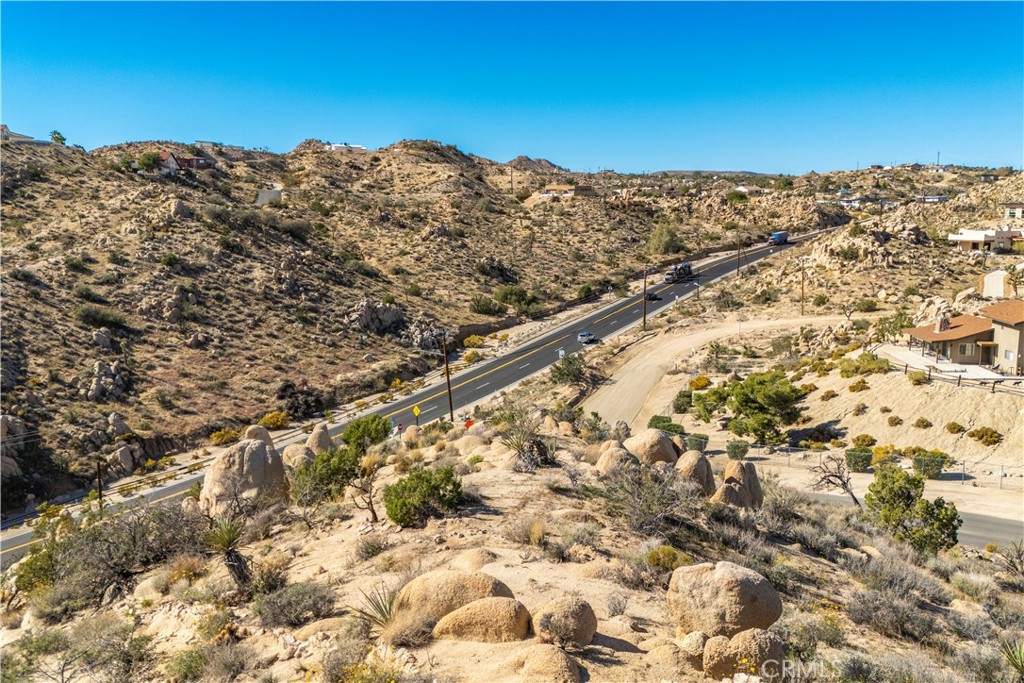 0 San Juan Road Yucca Valley, CA 92284 - Photo 13 of 24 a view of a large building with mountains in the background