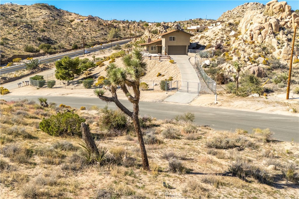 0 San Juan Road Yucca Valley, CA 92284 - Photo 17 of 24 a view of a yard with snow on the road