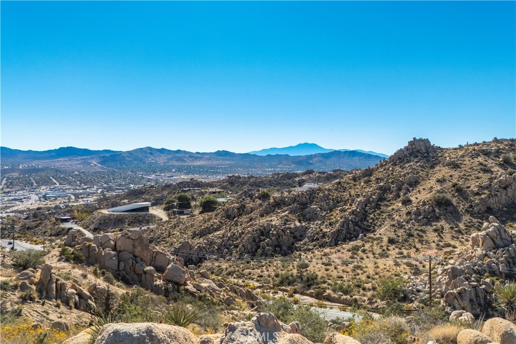 0 San Juan Road Yucca Valley, CA 92284 - Photo 22 of 24 a view of a mountain in the distance in a field