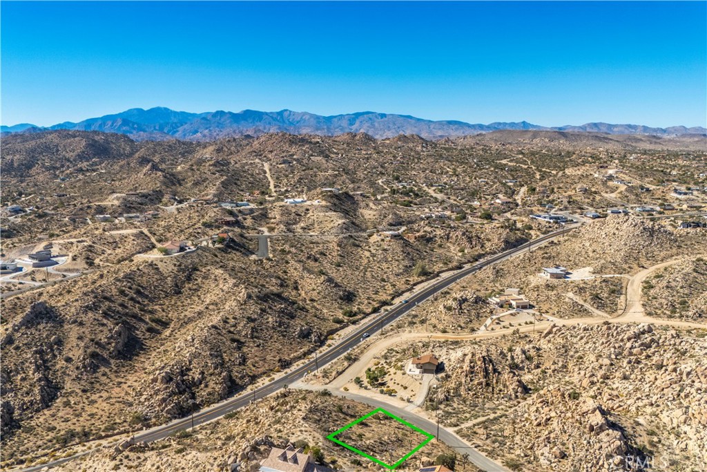 0 San Juan Road Yucca Valley, CA 92284 - Photo 7 of 24 a view of a city with mountains in the background