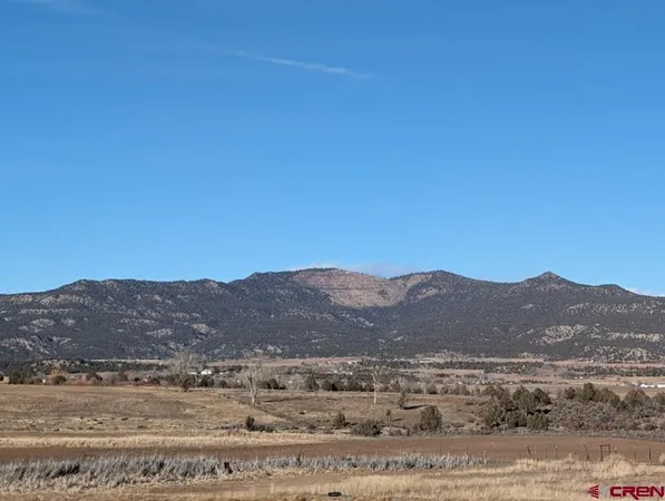a view of mountain and a mountain