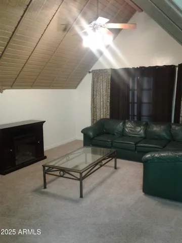 a view of a kitchen area with furniture and window