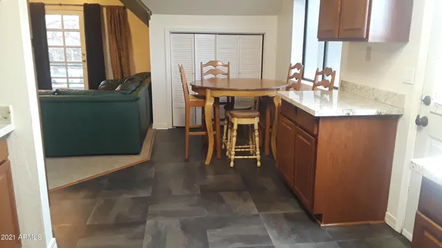 a view of a dining room with furniture and window
