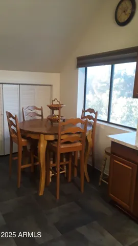 a kitchen with cabinets and a window