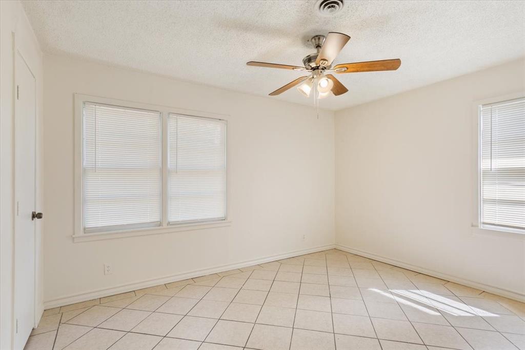2424 South 26th Street Waco, TX 76706 - Photo 15 of 25 an empty room with windows and fan