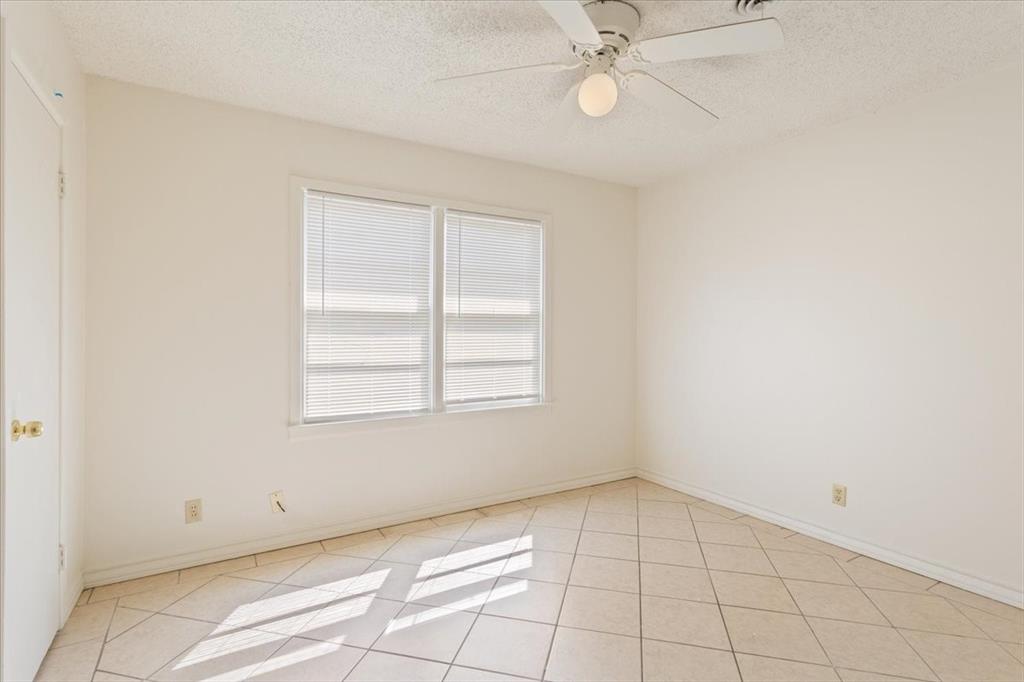 2424 South 26th Street Waco, TX 76706 - Photo 16 of 25 an empty room with a ceiling fan and window
