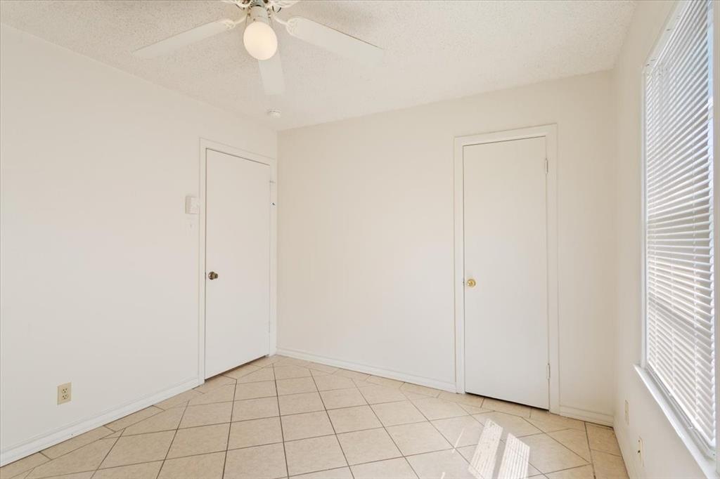 2424 South 26th Street Waco, TX 76706 - Photo 20 of 25 wooden floor in an empty room with a window