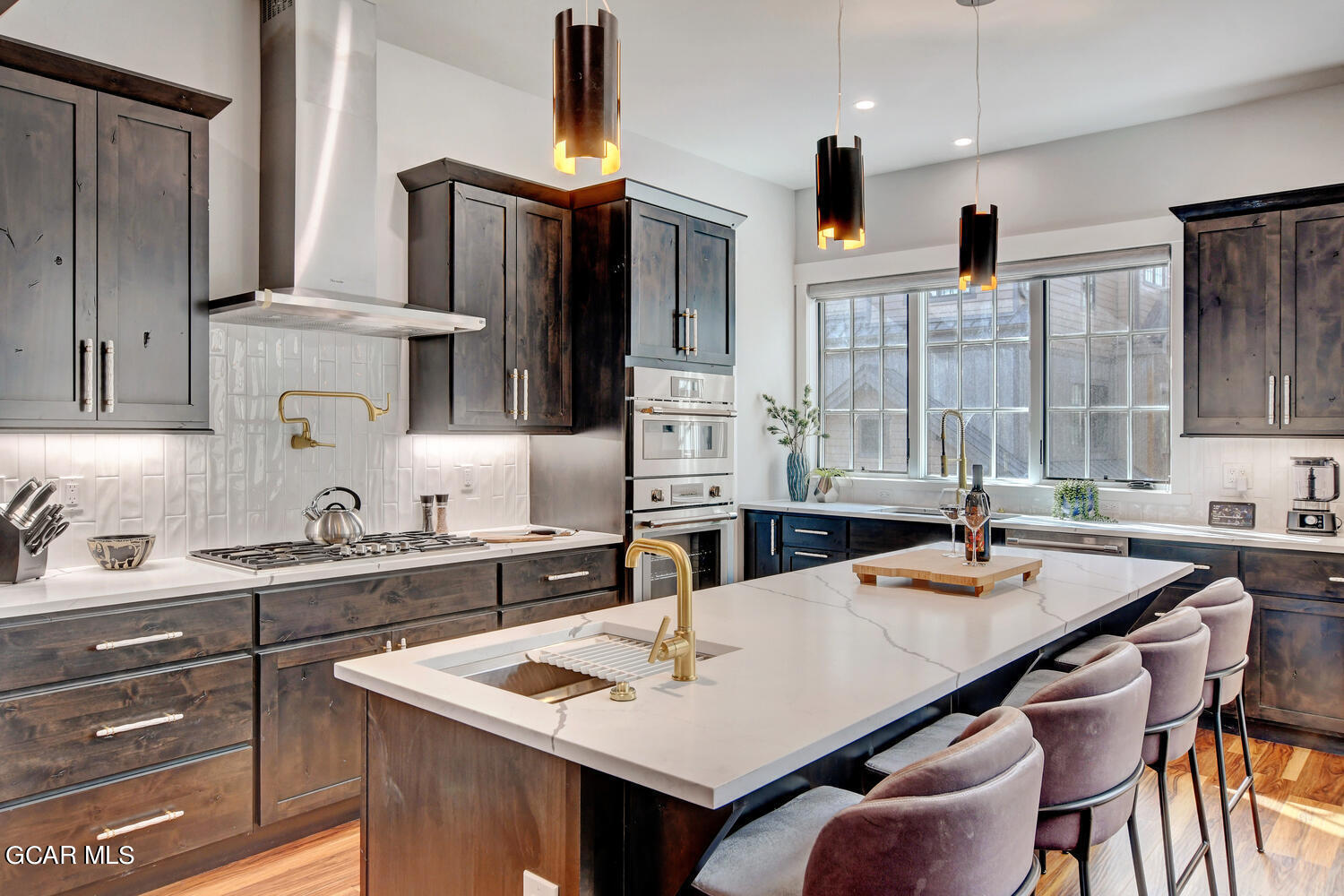 Undisclosed Address Winter Park, CO 80482 - Photo 11 of 52 a kitchen with a stove a sink and a refrigerator