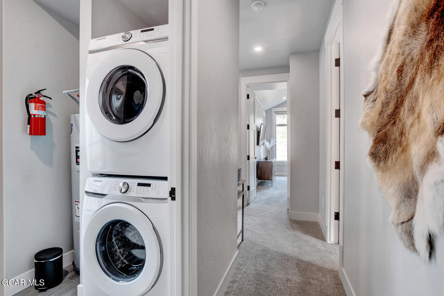 Undisclosed Address Winter Park, CO 80482 - Photo 28 of 52 a view of a hallway with washer and dryer