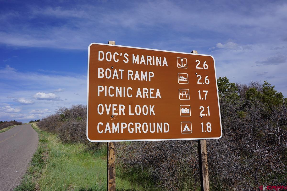 19305 Road 26.2 Loop Dolores, CO 81323 - Photo 12 of 23 a sign broad on the side of the road