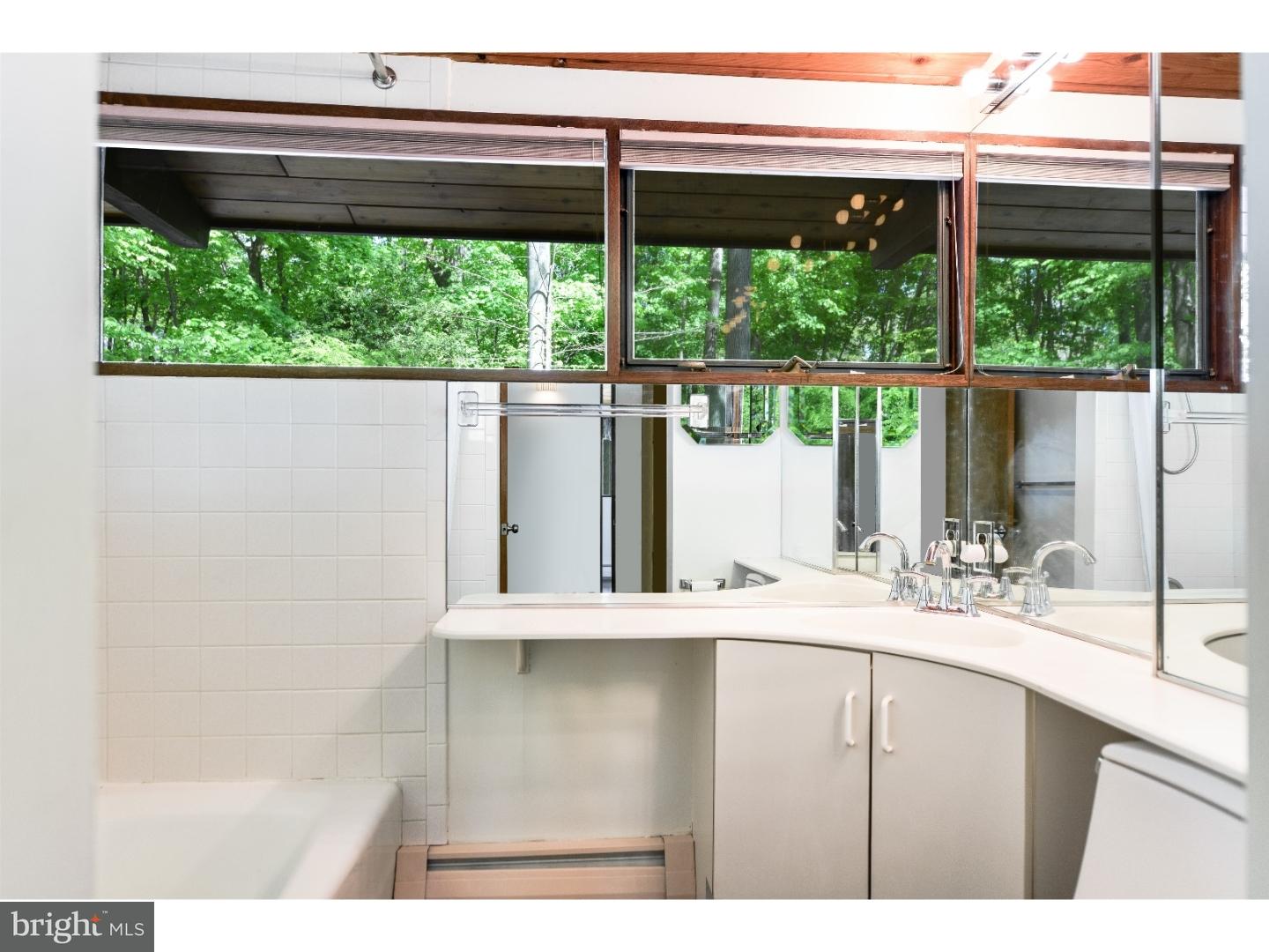 731 Limehouse Road Wayne, PA 19087 - Photo 14 of 25 a bathroom with a sink and a large window