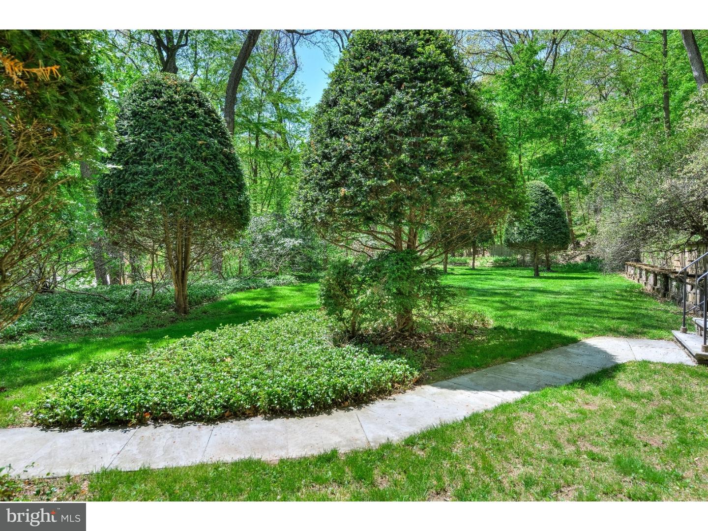 731 Limehouse Road Wayne, PA 19087 - Photo 22 of 25 a view of a grassy field with trees