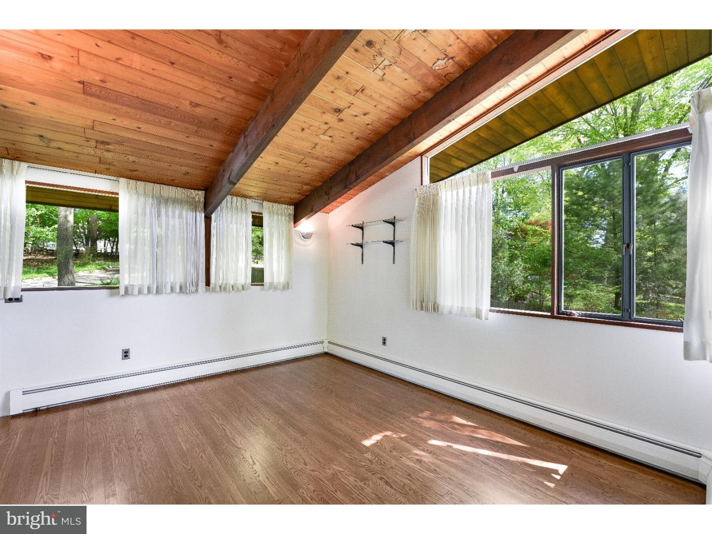 731 Limehouse Road Wayne, PA 19087 - Photo 8 of 25 a view of empty room with wooden floor and fan