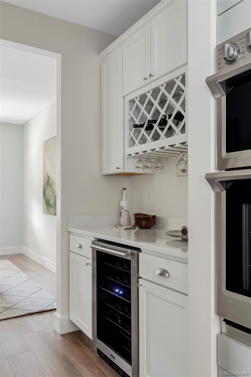2908 Ironton Street Denver, CO 80238 - Photo 10 of 30 a kitchen with stainless steel appliances granite countertop a stove and a microwave