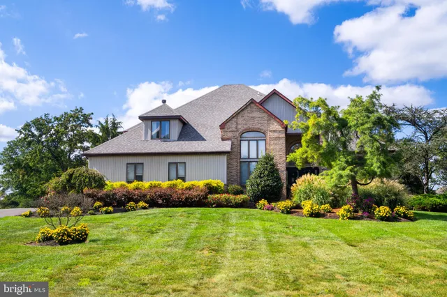 a front view of house with garden