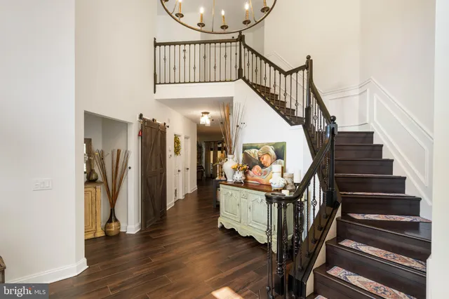 a view of kitchen with stainless steel appliances granite countertop sink stove and refrigerator