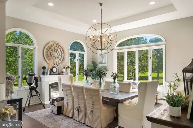 a dining room with furniture and wooden floor