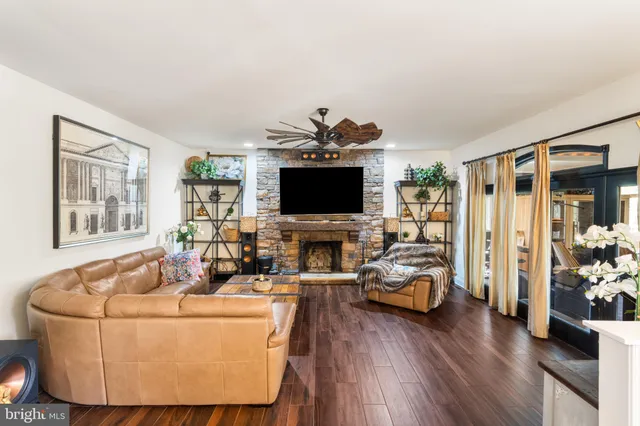 a bedroom with furniture and a flat screen tv