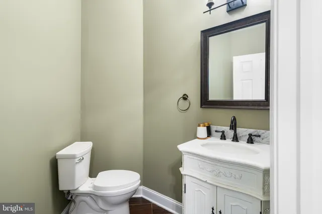 a bathroom with a sink a mirror a shower and a bathtub