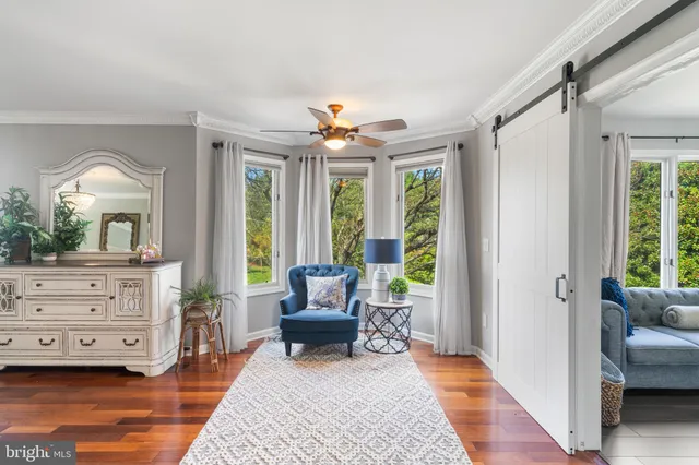 a bedroom with a bed and chair