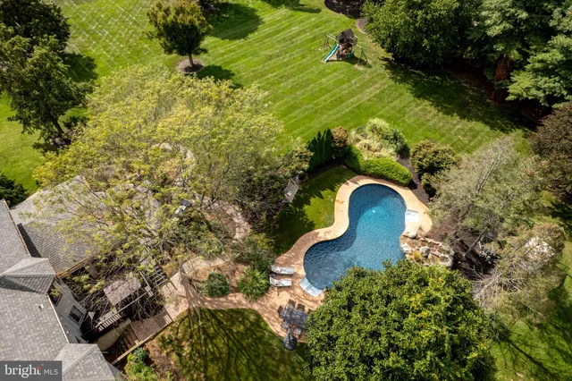 a front view of a house with a garden and pathway