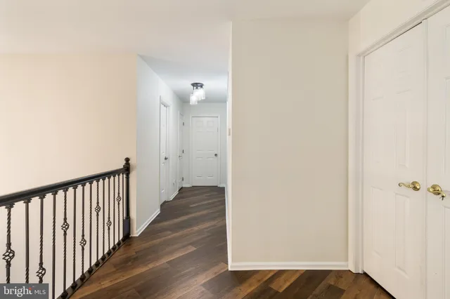 an aerial view of a residential houses with yard