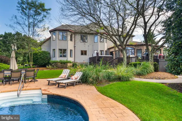 a view of a balcony with chair and potted plants