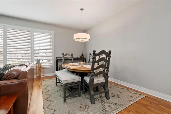 a dining room with furniture and window