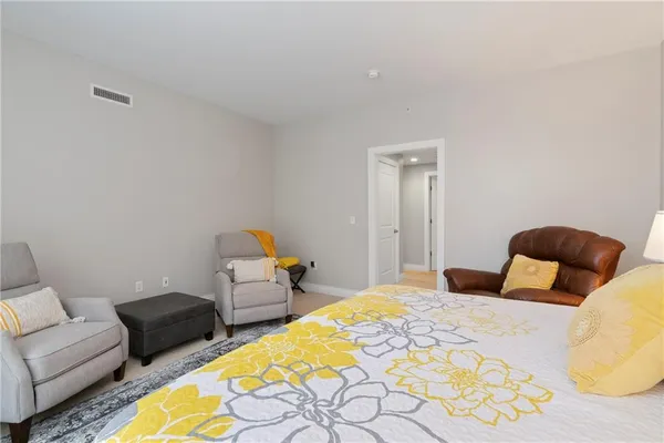 a bedroom with two beds and painted couch