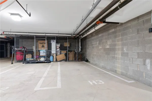an empty room with wooden floor and furniture