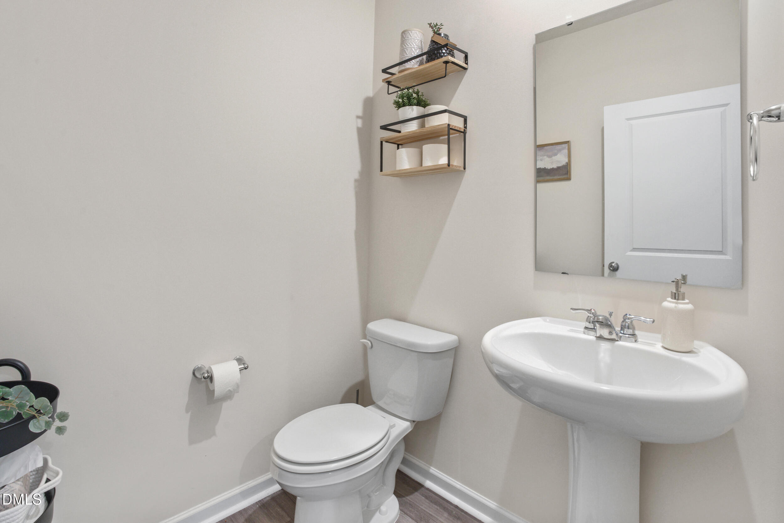 1416 Heron Pond Street Raleigh, NC 27604 - Photo 11 of 25 a bathroom with a sink toilet and a mirror
