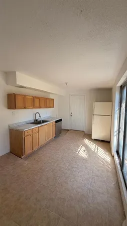 a view of a kitchen with a sink and dishwasher