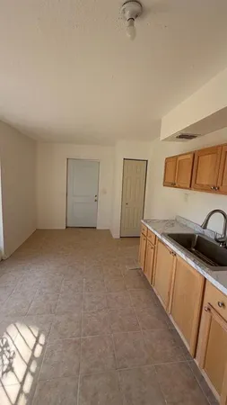 a kitchen with stainless steel appliances granite countertop a sink and cabinets