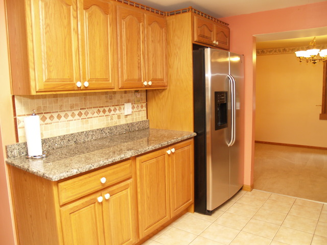 457 Rockhurst Road Bolingbrook, IL 60440 - Photo 4 of 24 a bathroom with a granite countertop sink and a shower